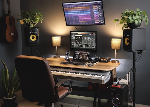 a desk with a keyboard and a monitor