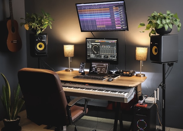 a desk with a keyboard and a monitor