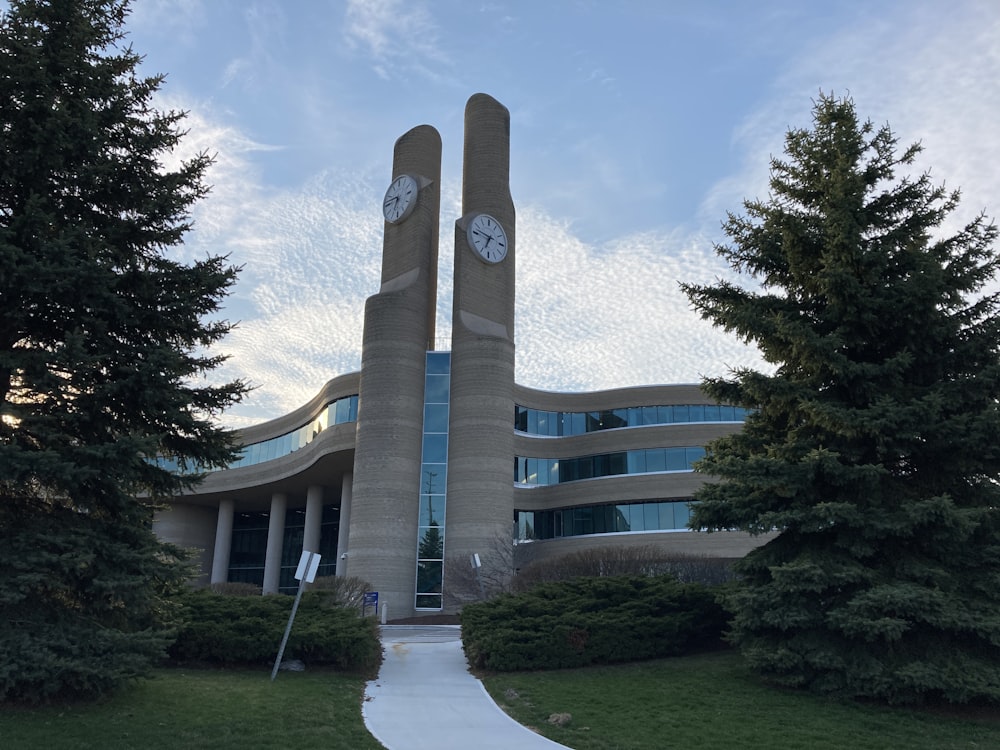 a large building with two clocks on it's sides