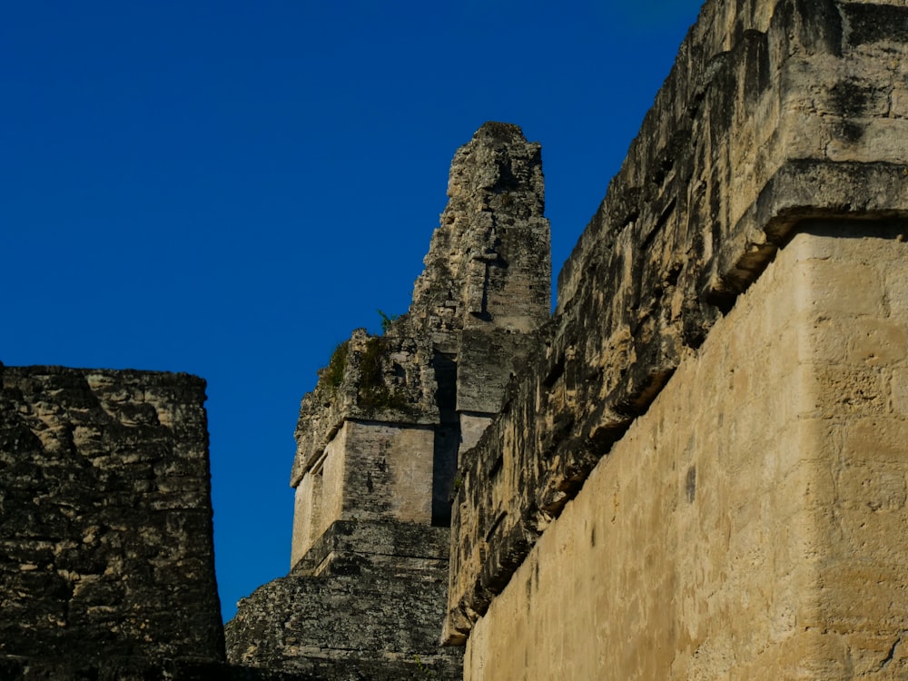 a stone building with a cross on the top of it