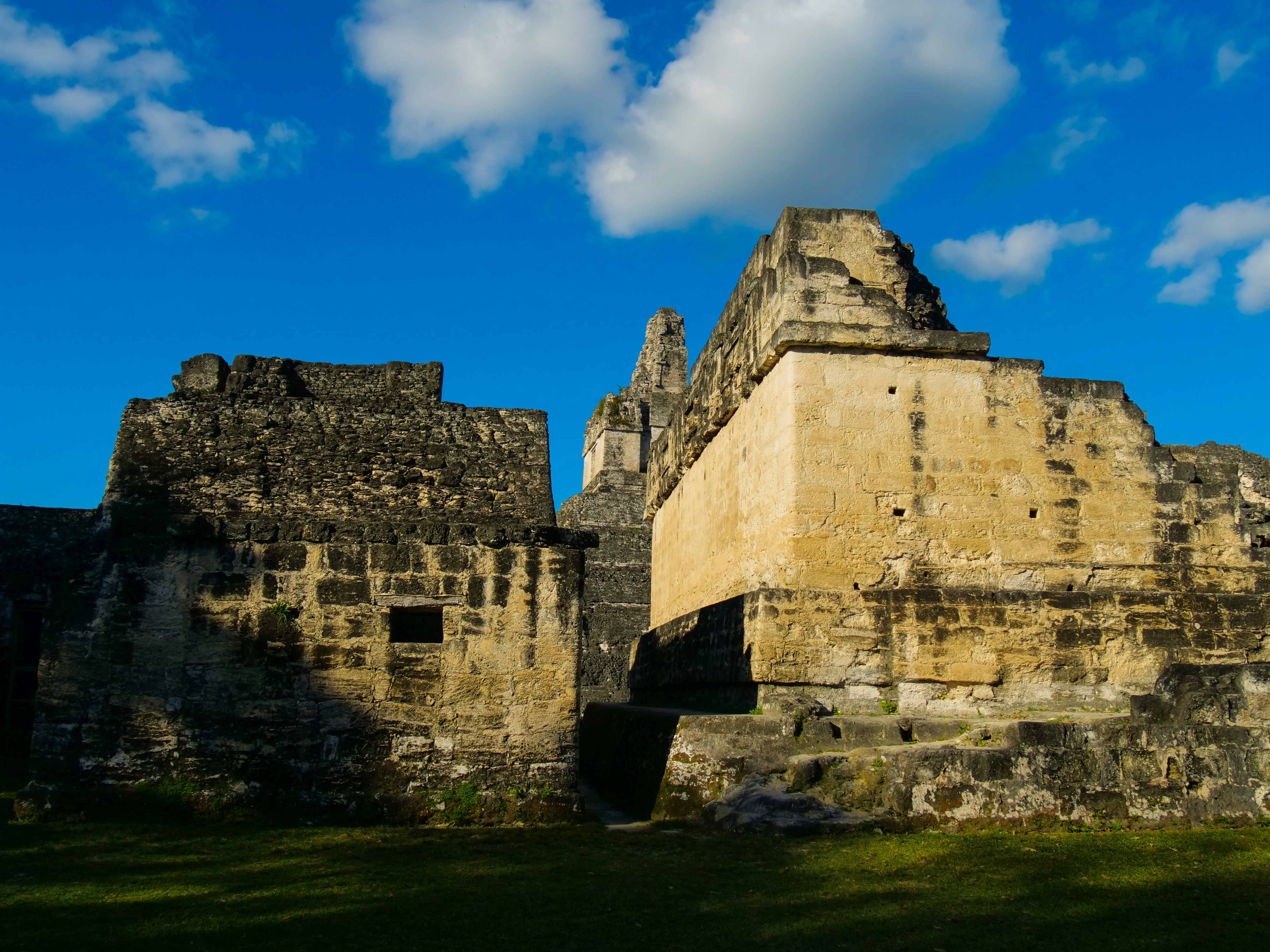 a large stone structure with a sky in the background