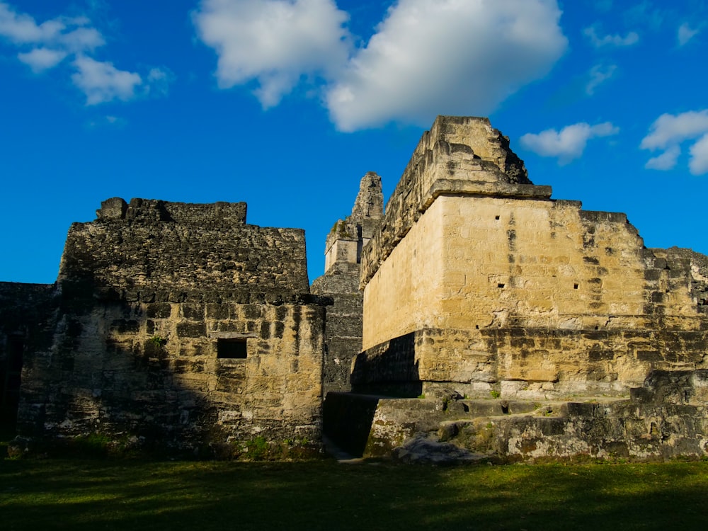 a large stone structure with a sky in the background