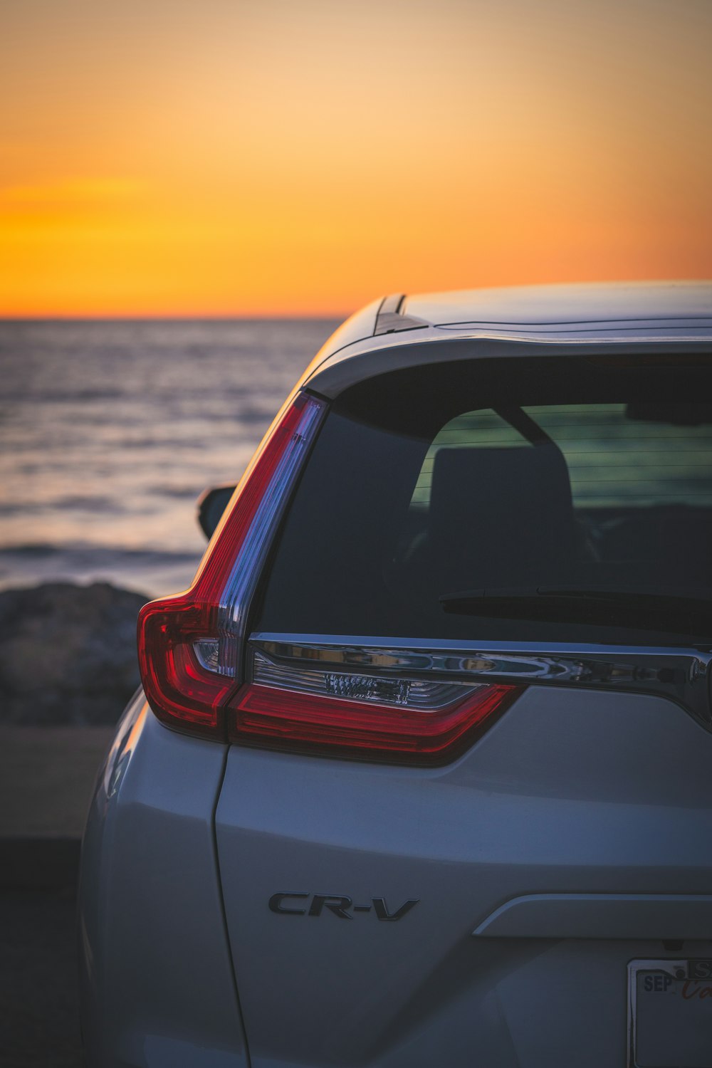 the back end of a white honda cr - v