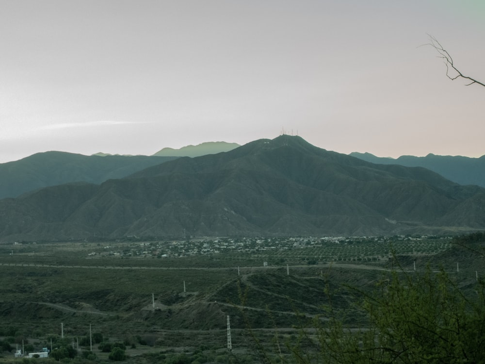 a view of a mountain range with a town in the distance