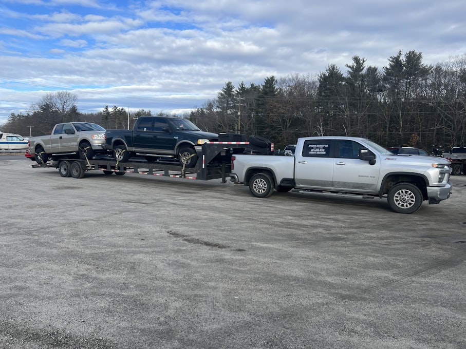 Tow truck and stored vehicles at a towing and vehicle storage facility