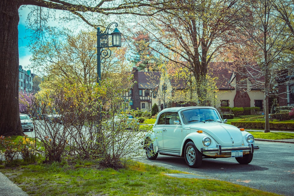 a white car parked on the side of the road