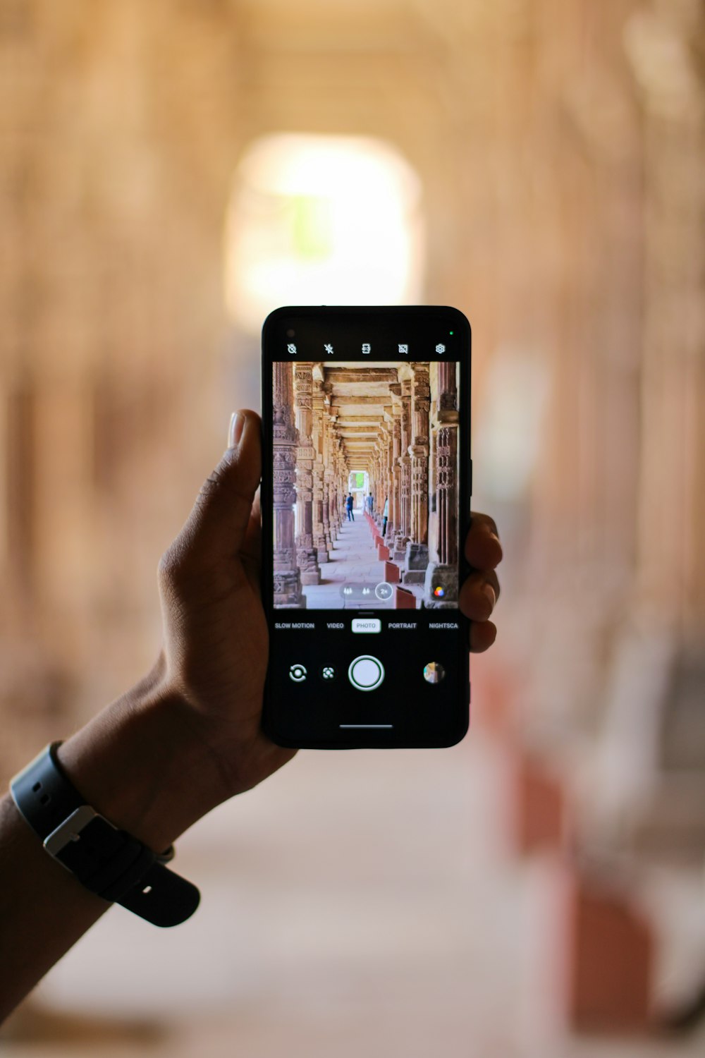 a person taking a picture with a cell phone