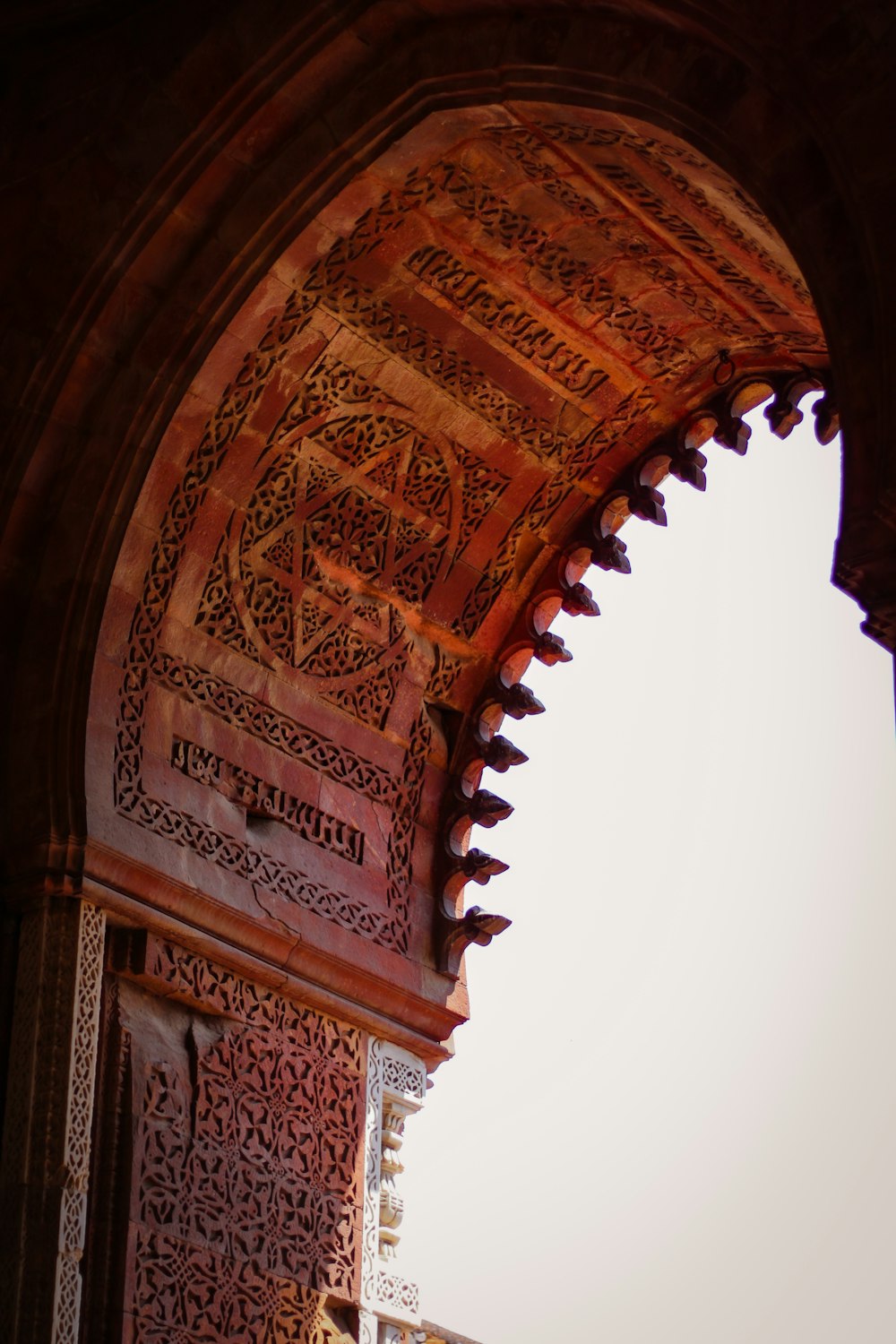 an arch in a building with a clock on it