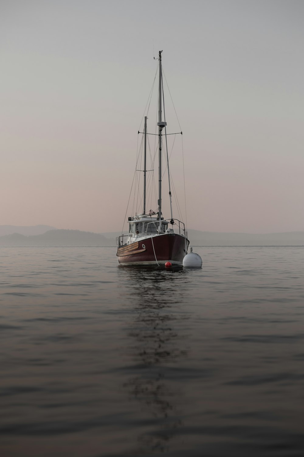 a boat floating on top of a large body of water