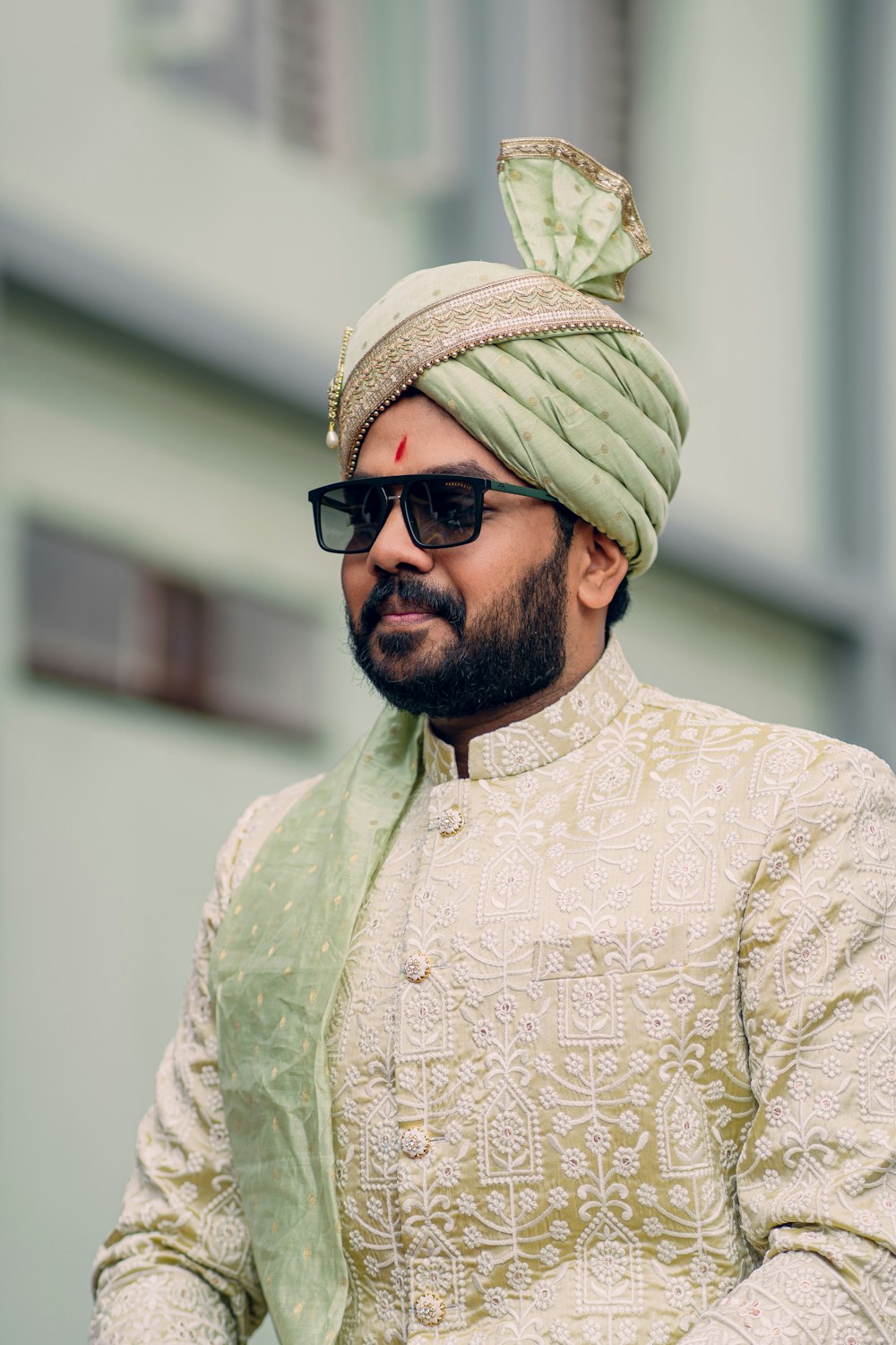 a man wearing a turban and sunglasses