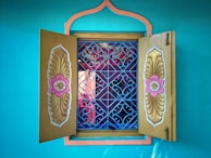 Detail of a navy blue wall with golden decorative elements in the office.