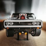 An intricate adult assembly kit model of a vintage car made from precise blocks.