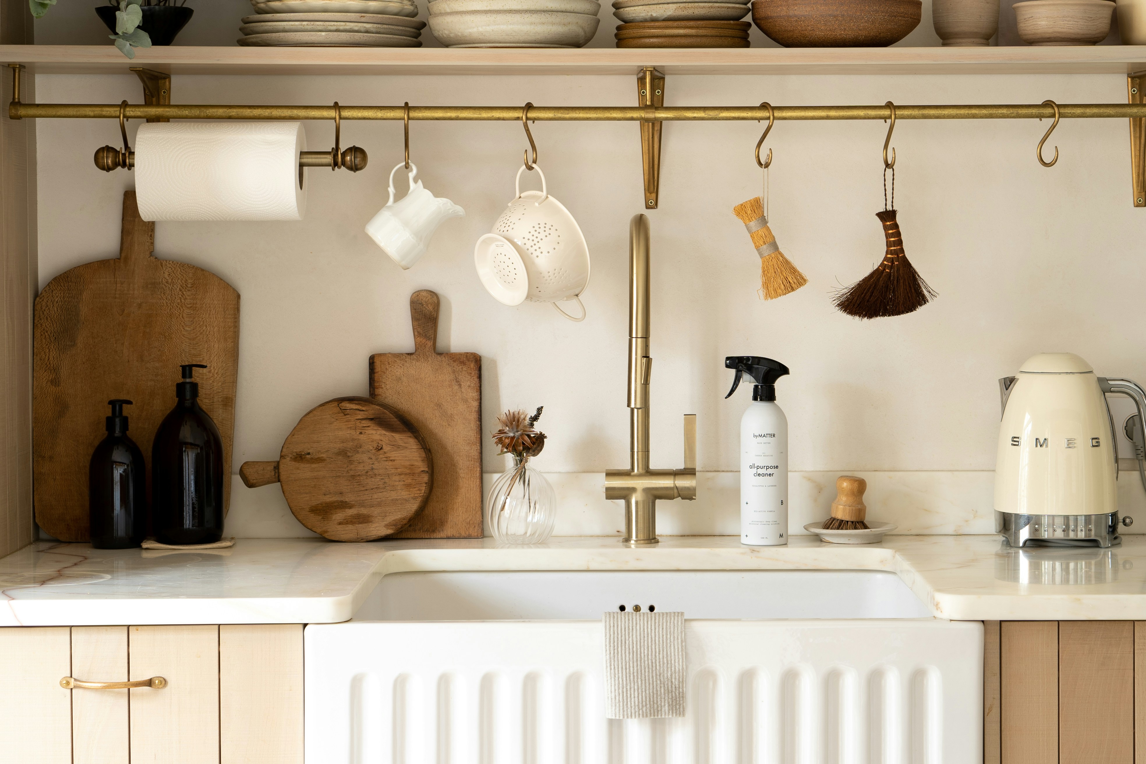 A professional cleaner wiping a kitchen counter, showcasing a cleaning service.