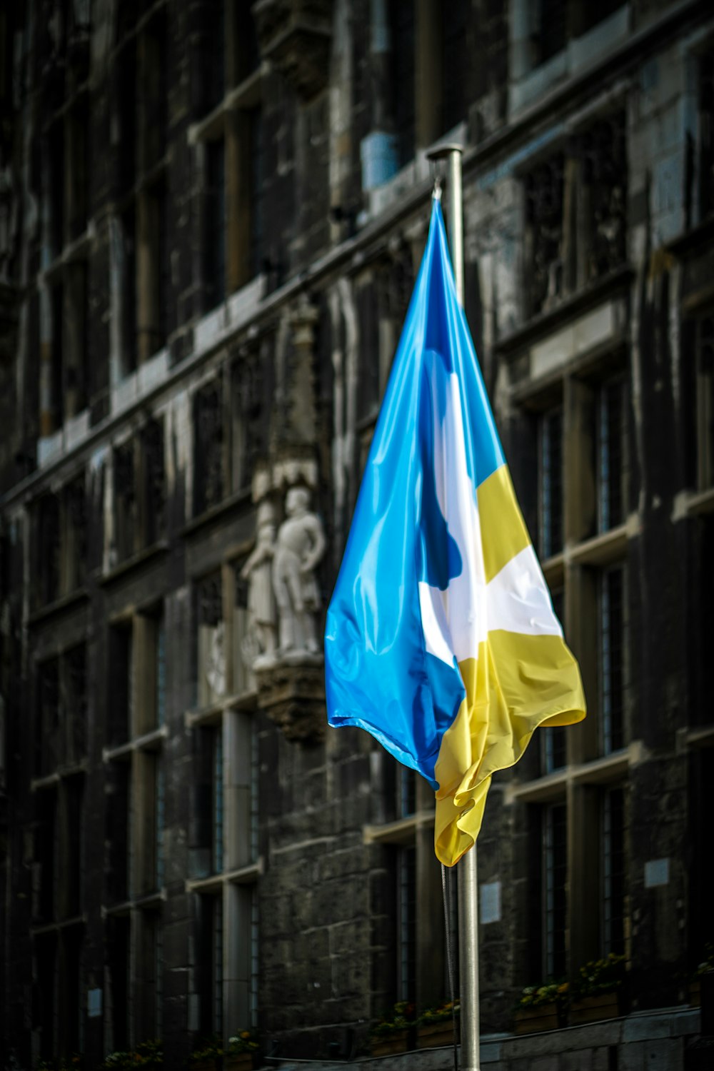 a flag on a pole in front of a building