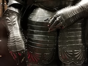 A close-up of a warrior's armor reflecting sunlight.