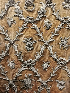 Elegant horse motif woven with shimmering threads on textile