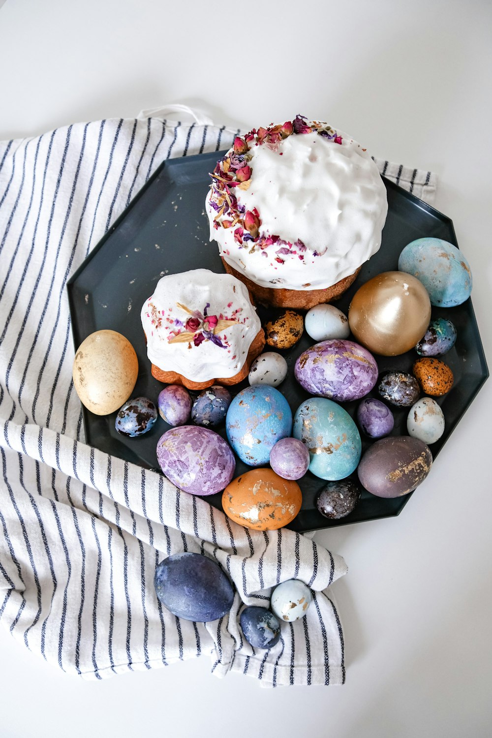 a plate with a cupcake and some eggs on it