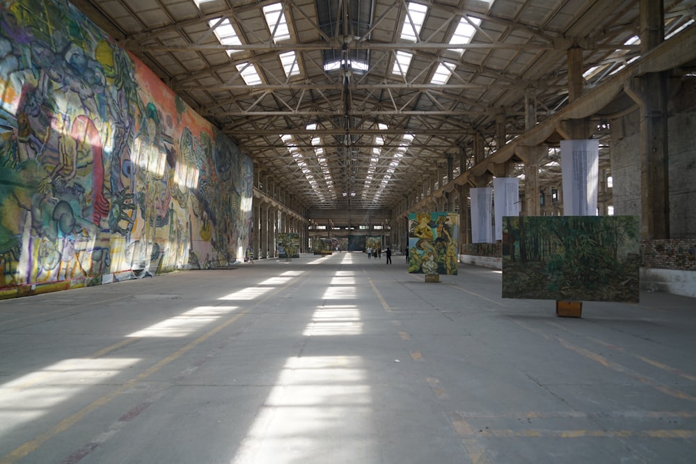 an empty warehouse with graffiti all over the walls
