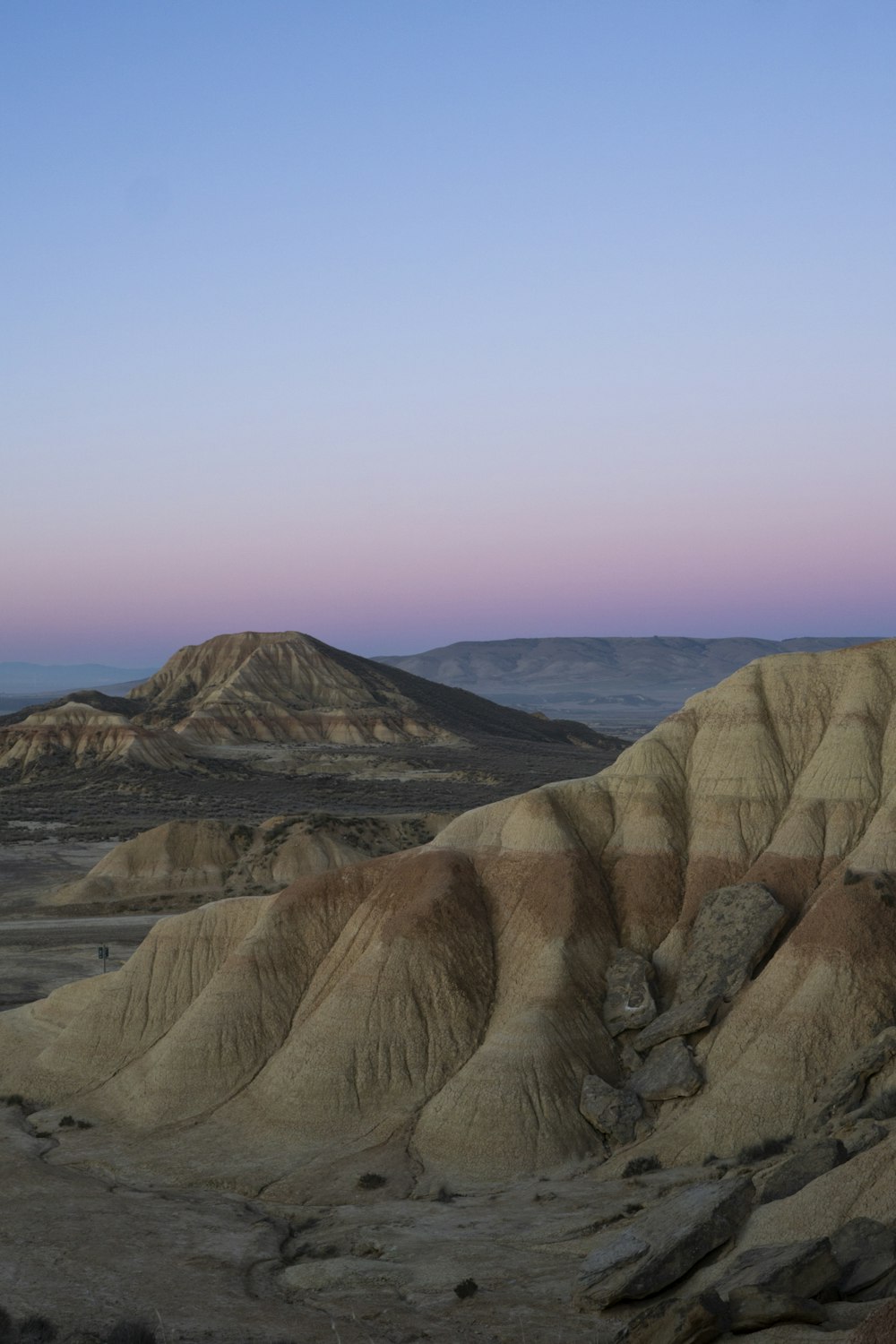 a view of a mountain range at dusk