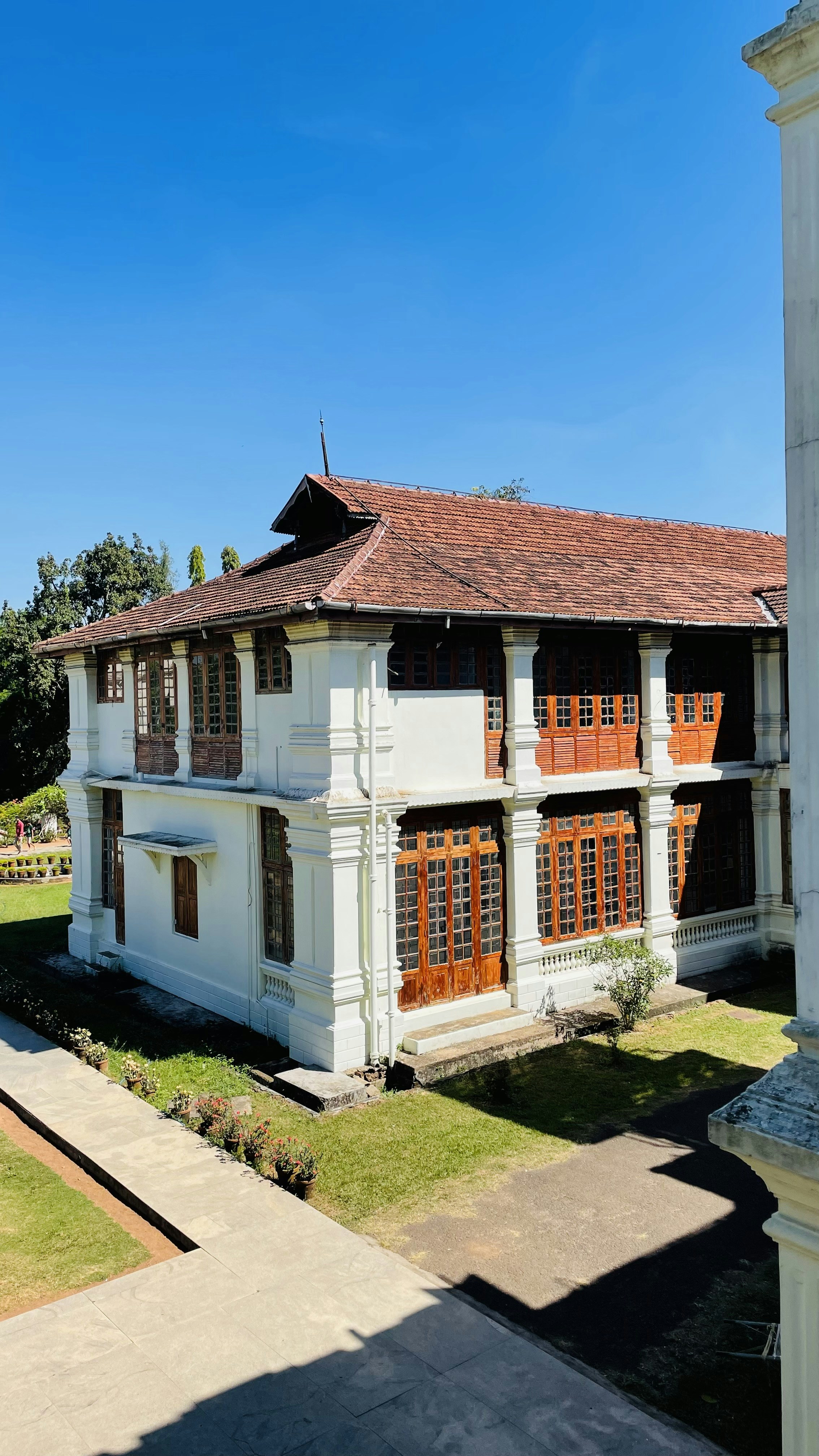 a large white building with a brown roof