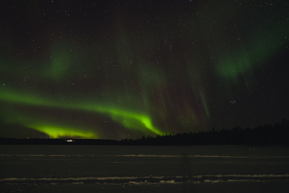 the aurora bore is shining brightly in the night sky