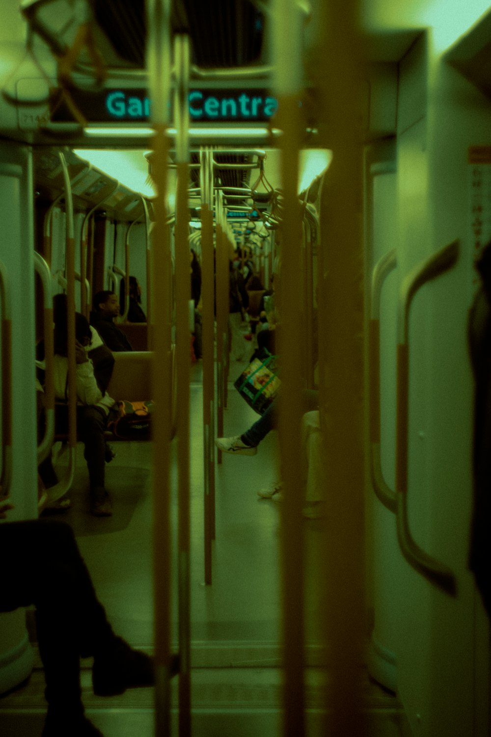 a group of people sitting on a train next to each other