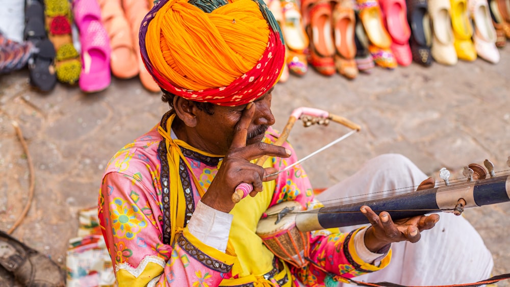 a man in a turban smoking a pipe