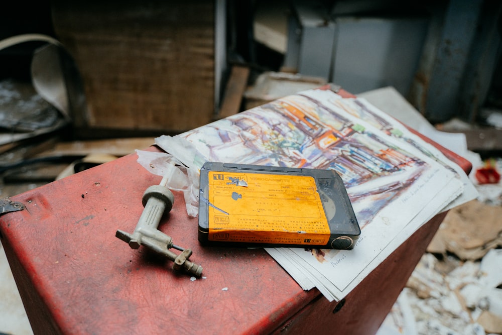 a tool sits on top of a red box