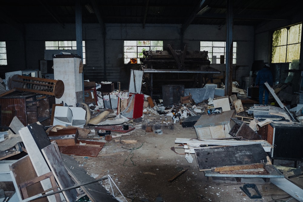 a room filled with lots of junk and furniture