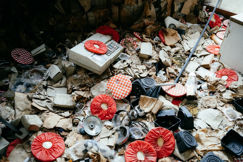 a pile of junk with red and white flowers