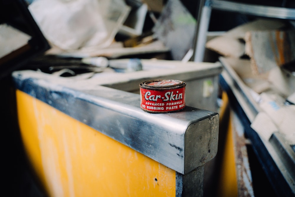 a can of food sitting on top of a metal counter