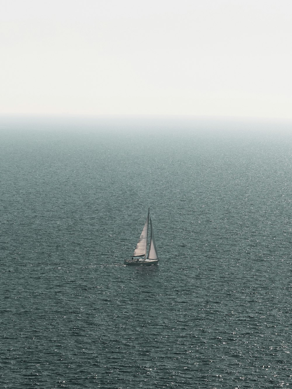 a sailboat in the middle of a large body of water