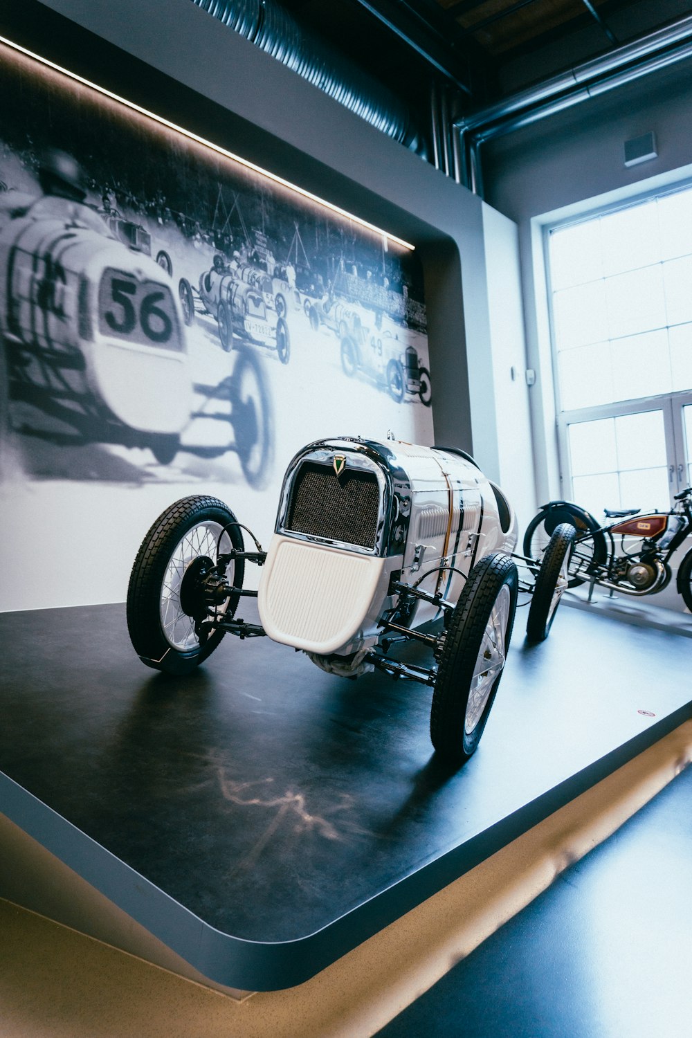 a model of a car on display in a museum