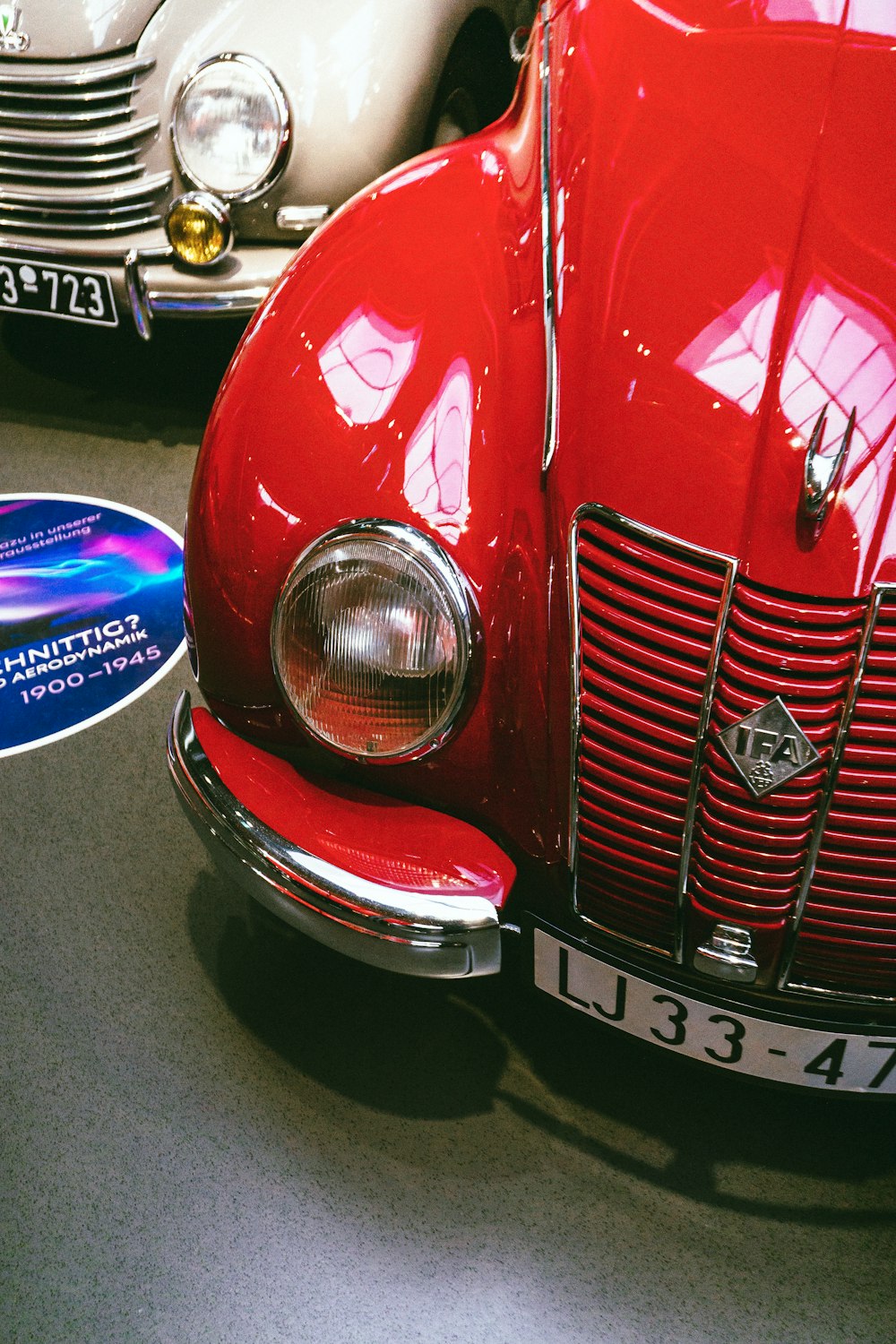 a close up of the front of a red car