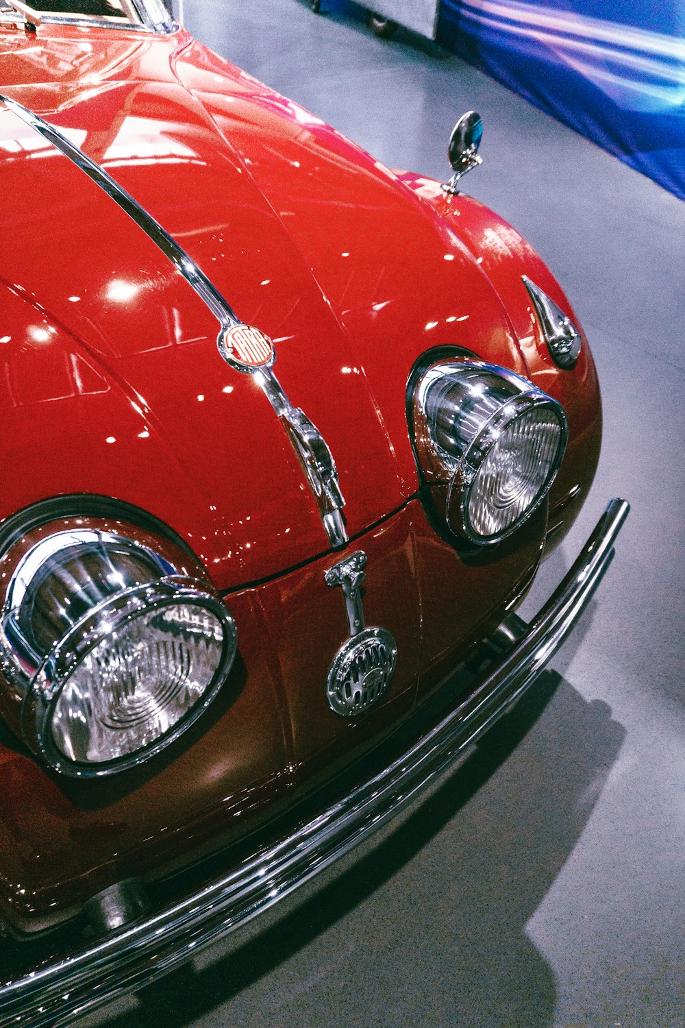 a close up of a red car on display