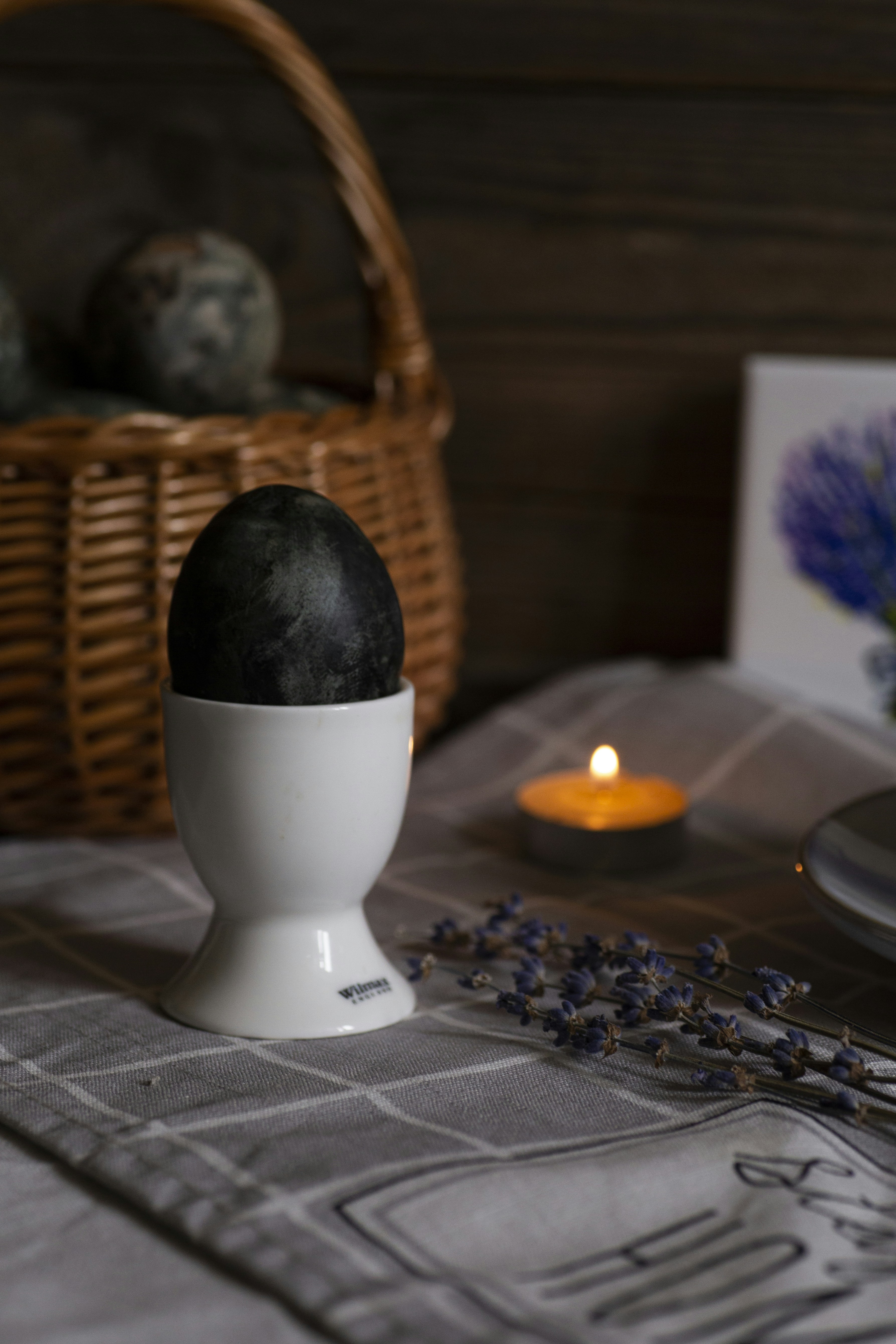 a table with a basket and a candle on it