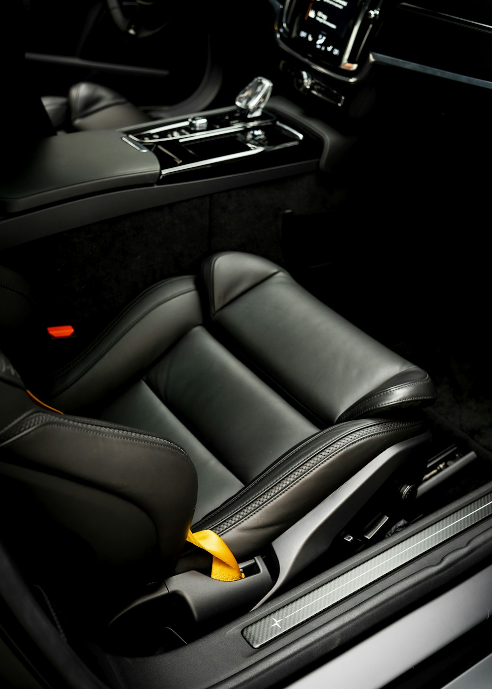 the interior of a car with black leather seats