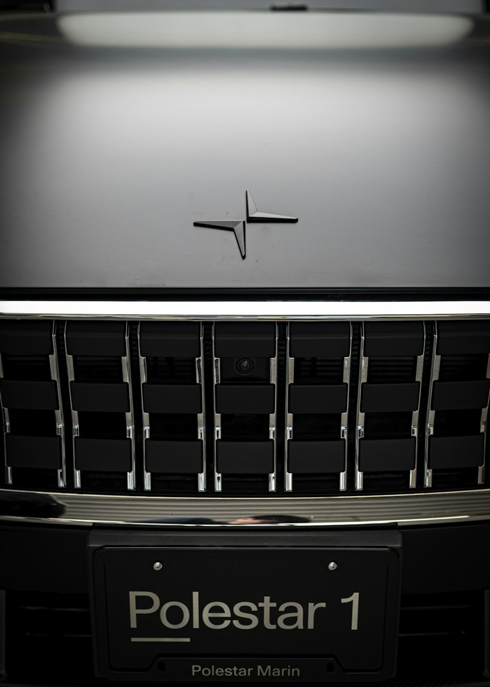 a close up of the front grille of a car