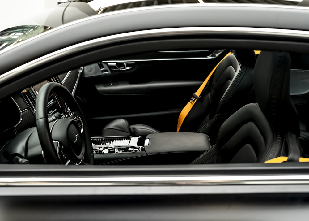 the interior of a car with a steering wheel