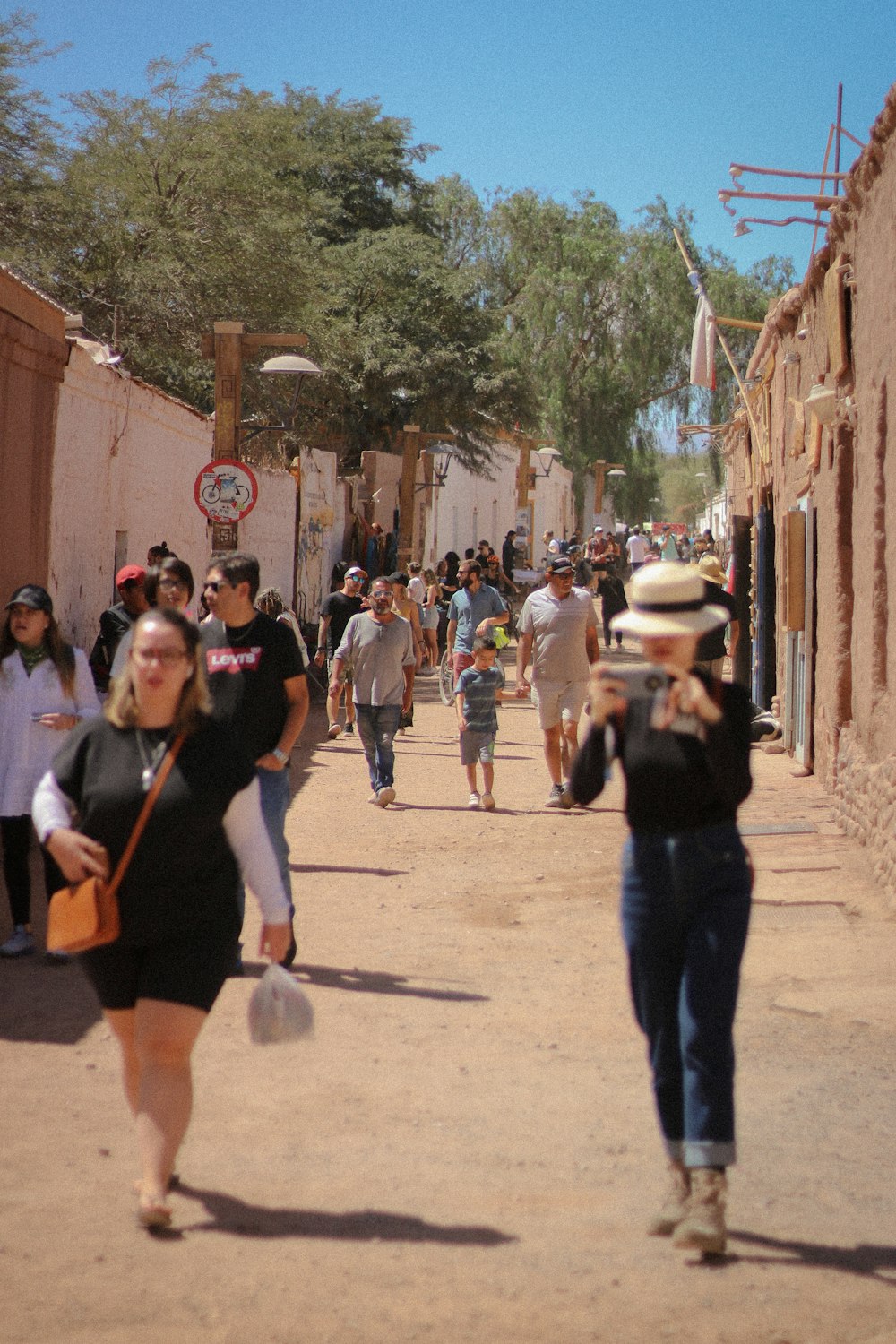 a group of people walking down a street