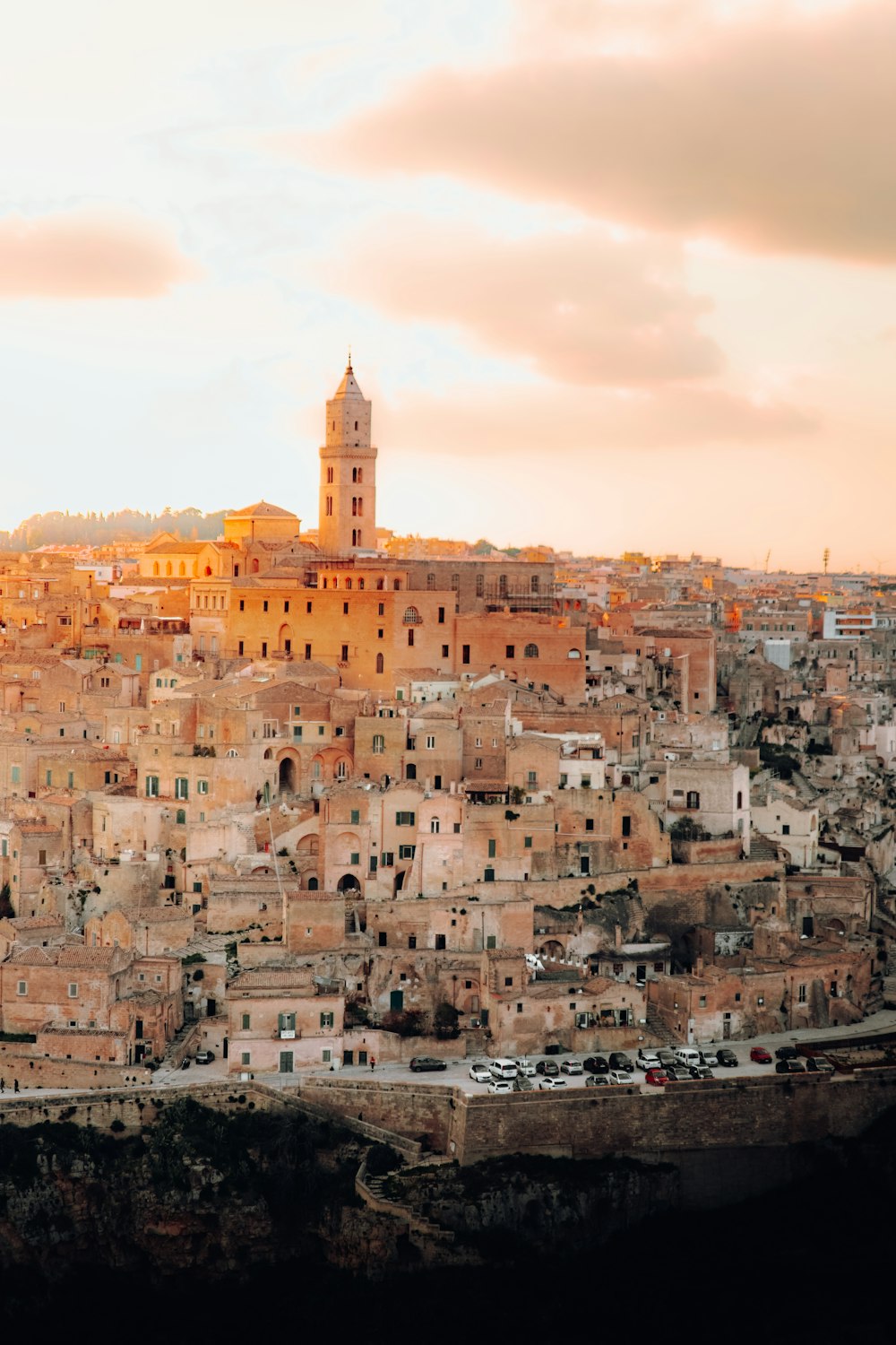 a view of a city with a clock tower in the background