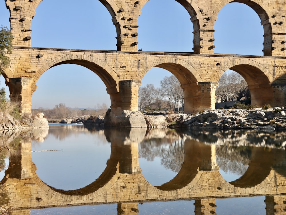 a stone bridge over a body of water