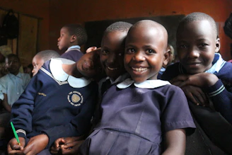 a group of young children standing next to each other