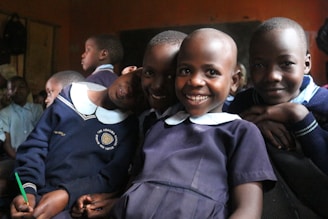 a group of young children standing next to each other
