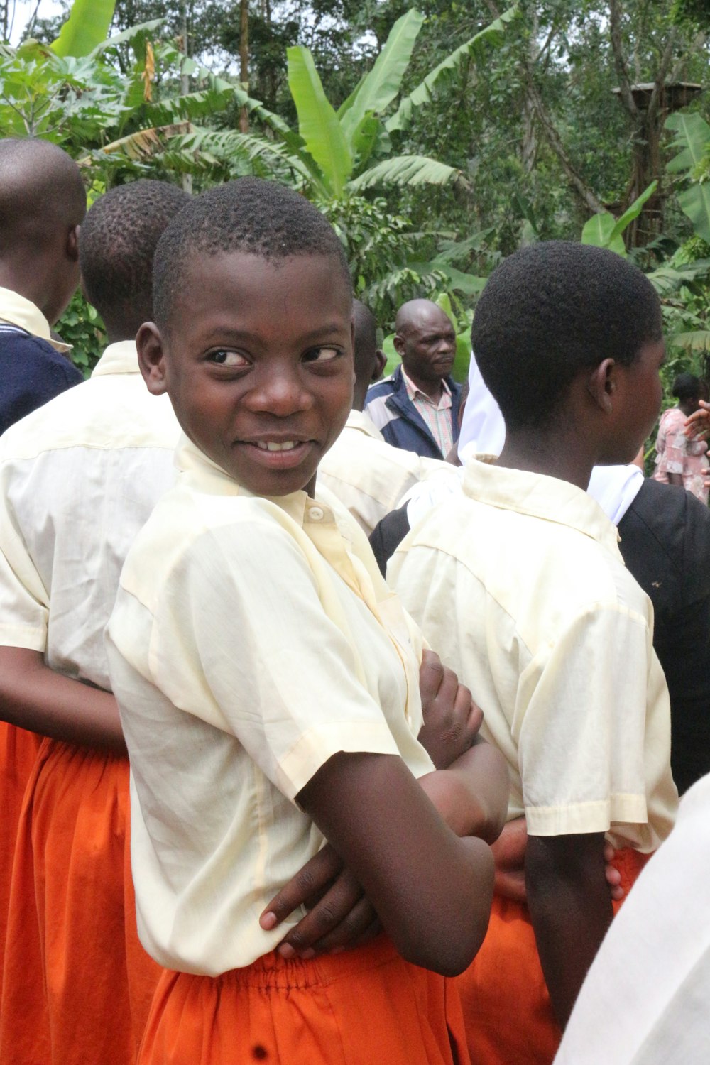 a group of young boys standing next to each other