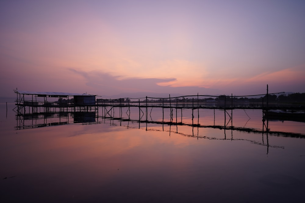 a dock that is sitting in the middle of a body of water