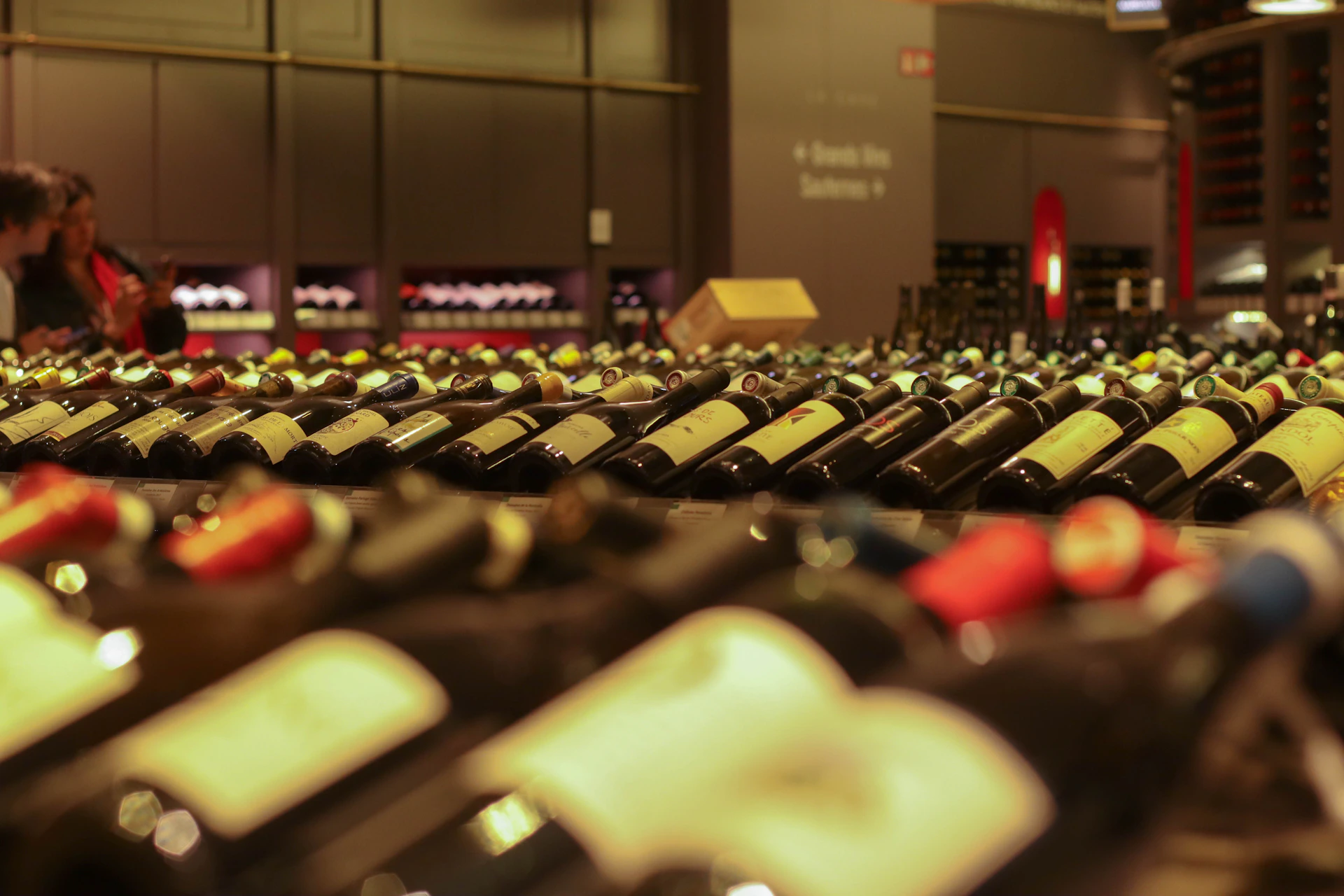 rows of bottles of wine in a wine cellar