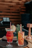 A beautifully arranged cocktail display featuring vibrant colors and garnishes.