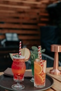 A vibrant cocktail setup showcasing colorful drinks and garnishes.
