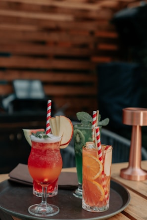 A selection of colorful cocktail ingredients arranged on a table.